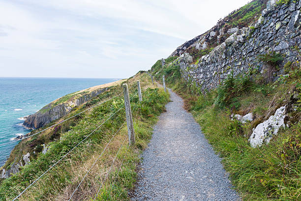 istock Stone rocks mountain hiking path at Irish seacoast. Bray, Greyst 515805664