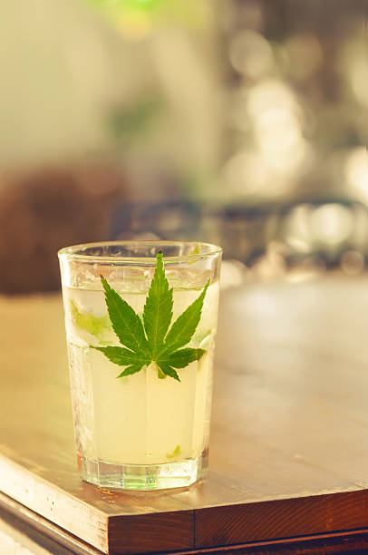 Close-up of glass with ice and alcohol on a table