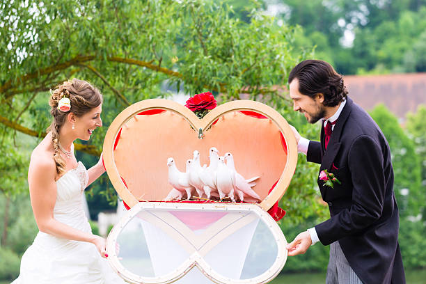 Miniature small doll of couple lovers propose for marriage with romantic valentine moment with background of document asset house car vehicle, metaphor concept trade love money
