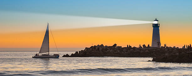 Light house with sunset in the background stock photo