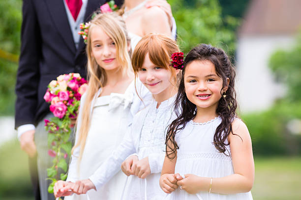 istock Wedding bridesmaids children with flower basket 515807564