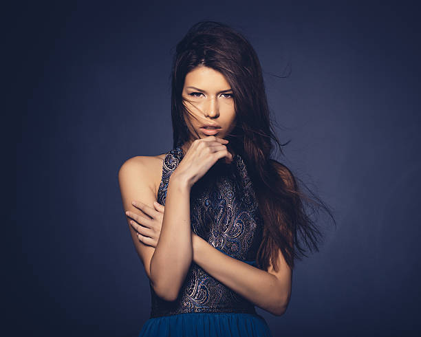 istock Attractive girl with flying hair posing in studio 515807565
