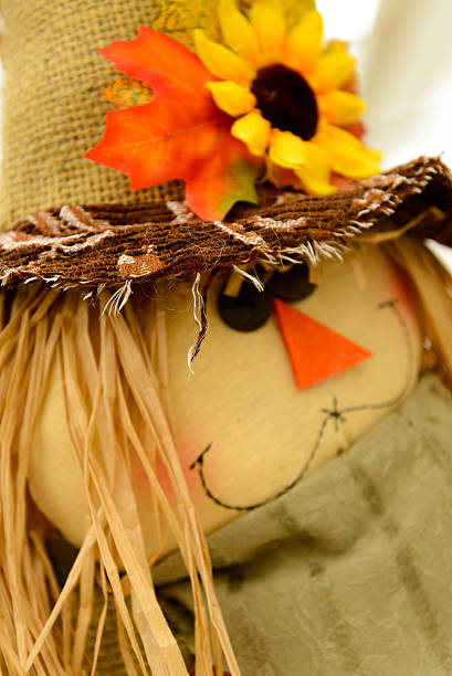 istock scarecrows with flowers and hay 515807691