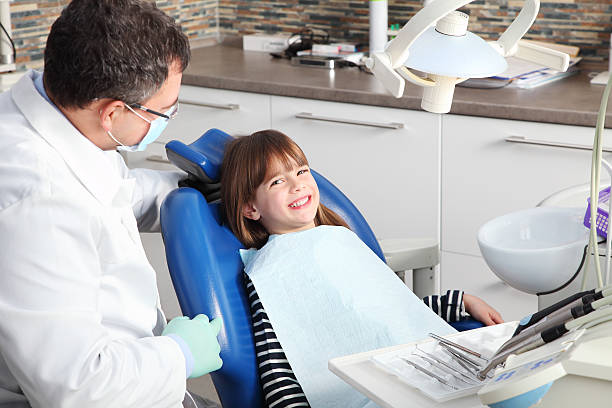 istock Male dentist and young patient 515808036