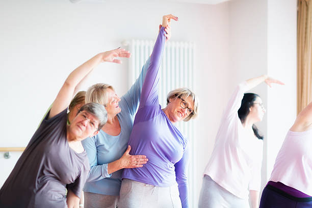 istock instructor with active senior women in yoga class 515808418