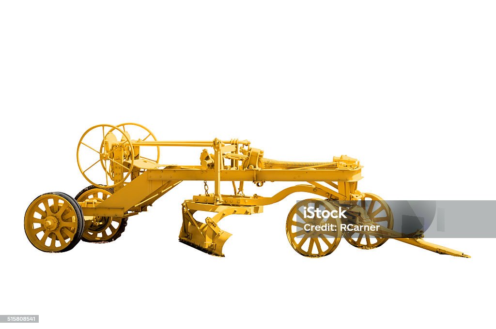 Antique Road Grader Antique road grader isolated on a white background with a complex clipping path. Ancient Stock Photo