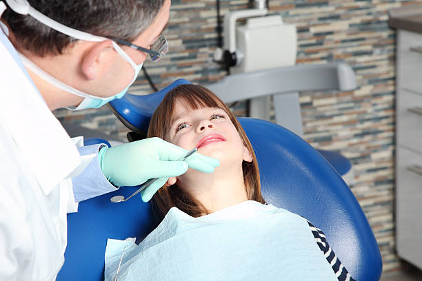 istock Male dentist and young patient 515808552