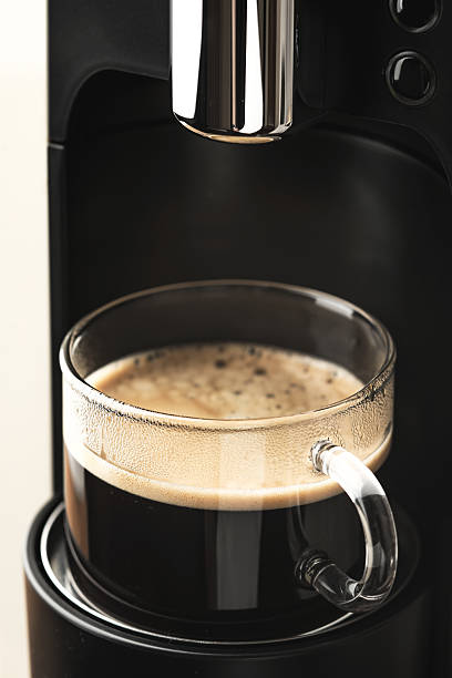 istock Glass cup of coffee in the coffee maker 515808666
