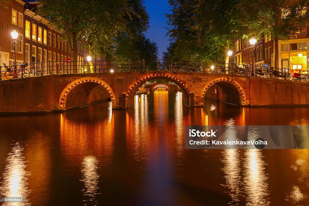 Night city view of Amsterdam canals and seven bridges Night city view of Amsterdam canals and seven bridges, Holland, Netherlands. Amsterdam Stock Photo