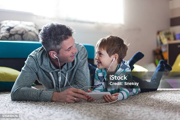 Father And Son Listening Music Stock Photo - Download Image Now - Listening, Child, Father