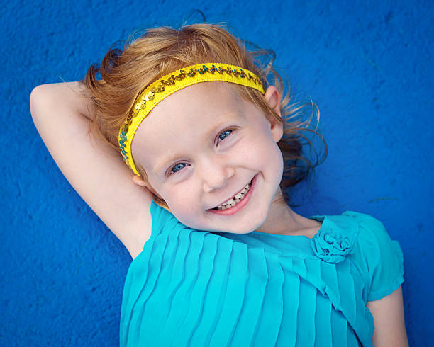 istock Little Girl on Blue Background 515811620