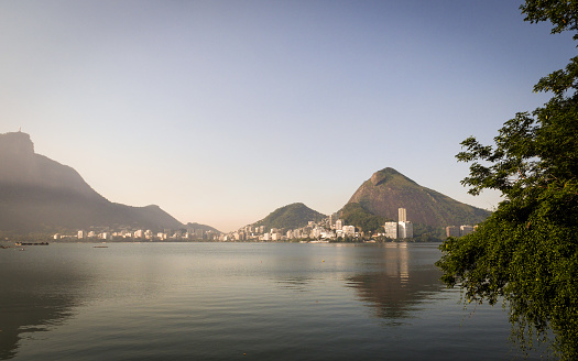 A view across the Lagoa de Freitas, a lagoon in the heart of Rio de Janeiro, Brazil, looking towards the hills of the Parque Natural Municipal Jose Guilherme Merquior.