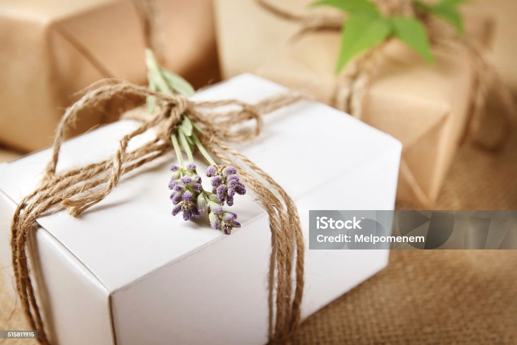 Handmade Gift Box with Lavender Sprig Handmade gift box with lavender sprig on burlap Art And Craft Stock Photo