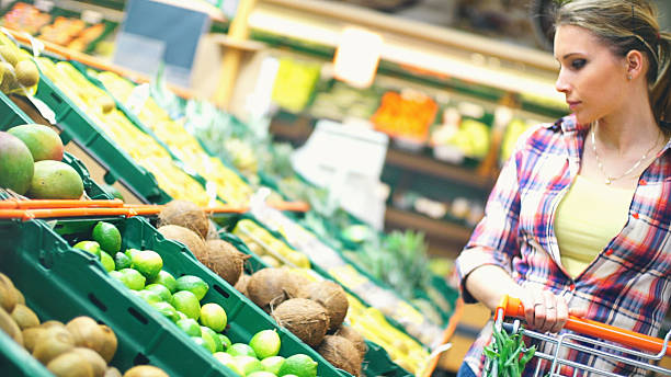 istock Woman choosing fruit in supermarket. 515811988