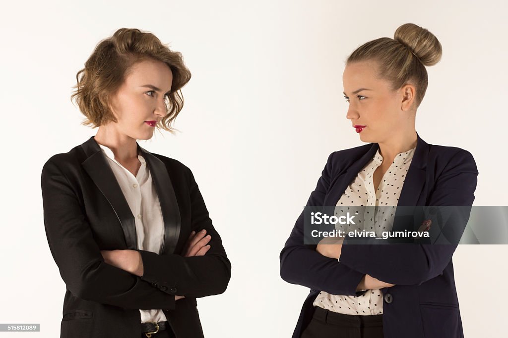 two business women swear two business women swear on a white background Abuse Stock Photo