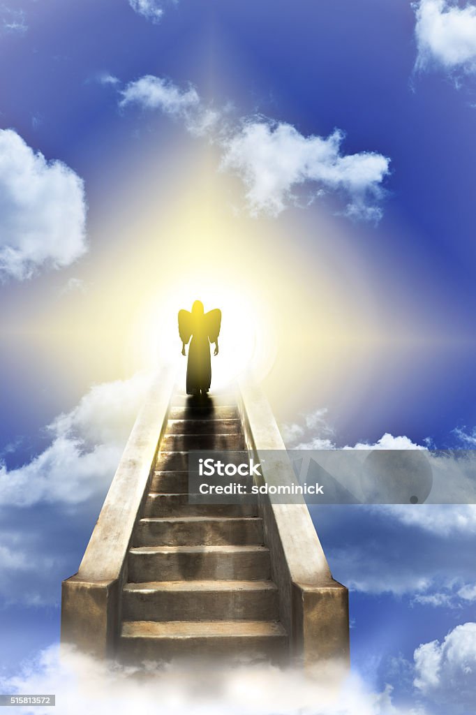 Angel On A Stairway To Heaven The silhouette of an angel walking up a stairway to heaven. Angel Stock Photo