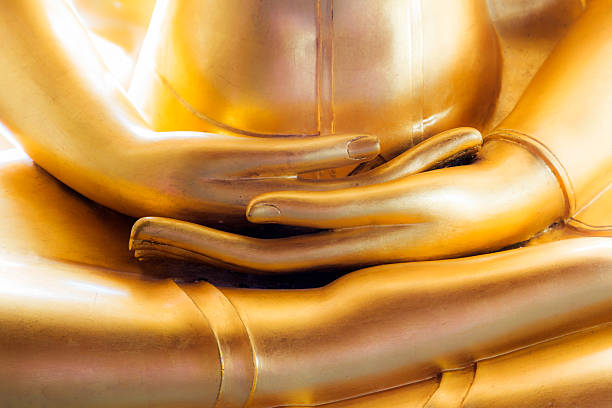 Close up hand of golden buddha