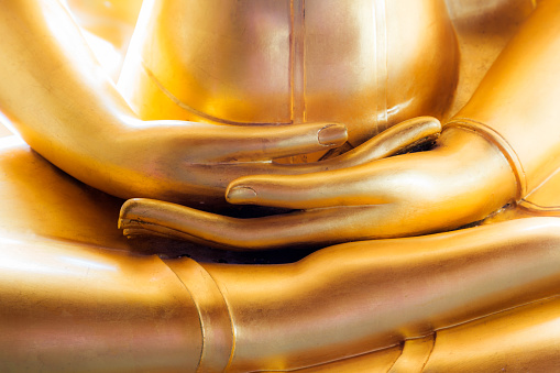 Close up hand of golden buddha