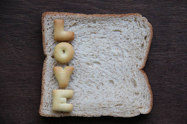istock The word love on bread. 515814269