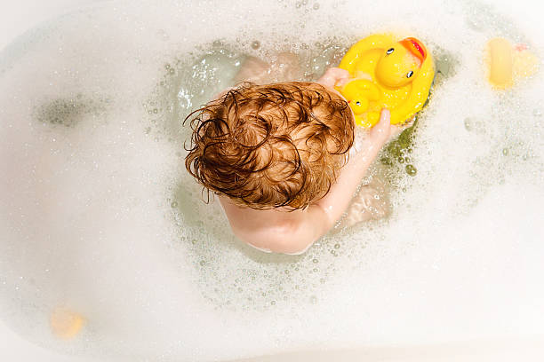 istock Toddler in tub with duck. 515815490