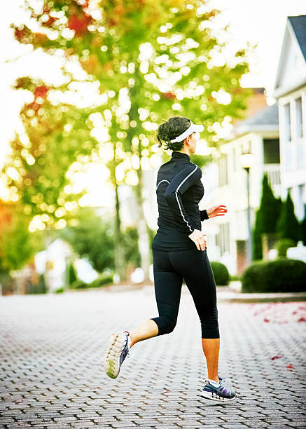 istock Woman Walking Dog 515816762
