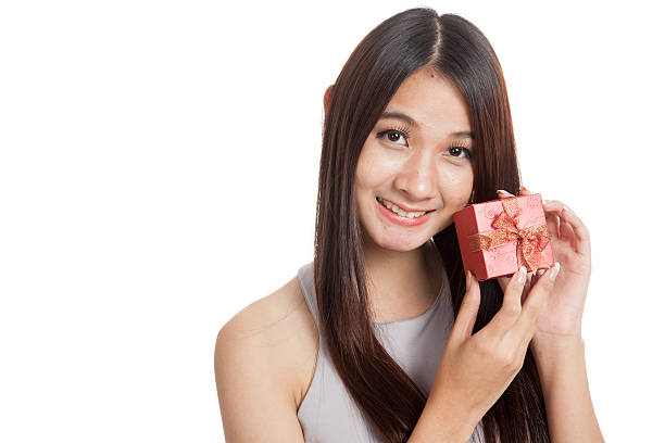 istock Beautiful young Asian woman with red gift box 515816776