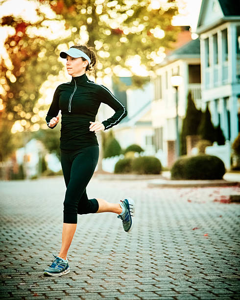istock Woman Walking Dog 515816996
