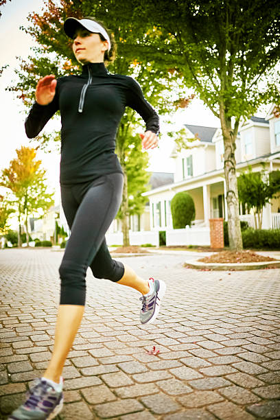 istock Woman Walking Dog 515823592