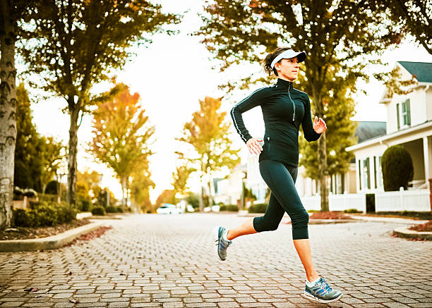 istock Woman Walking Dog 515823772
