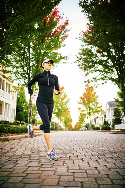 istock Woman Walking Dog 515824280