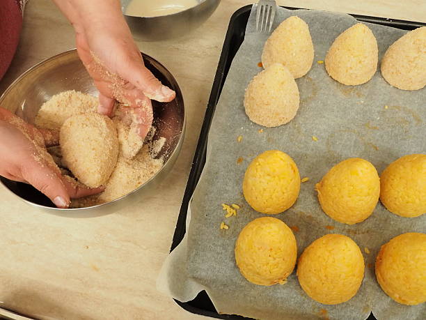 istock preparation of rice arancini 515826500