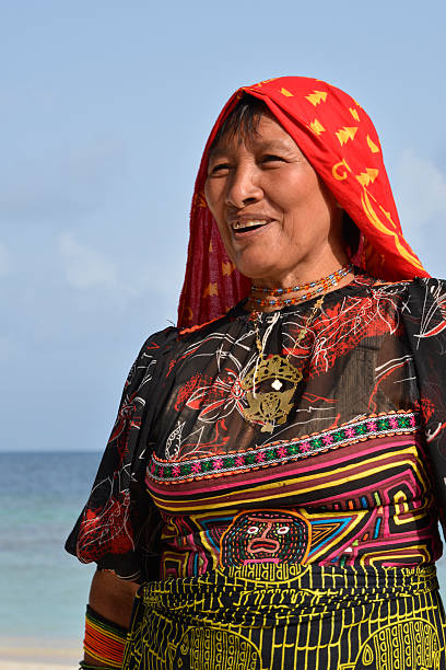 Traditional Kuna indian tribal woman San Blas, Panama - March 5, 2016: Traditional Kuna women indian on Aroma  Island at the San Blas archipelago in Panama. She is wearing the traditional clothing with mola embroidery and colorful bracelets, made of hundreds of small beads and worn on both the arms and legs. kuna yala stock pictures, royalty-free photos & images