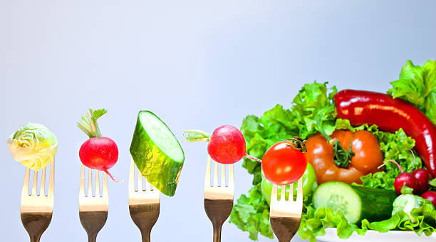 istock Vegetables on forks on a background of fresh vegetables 515827320