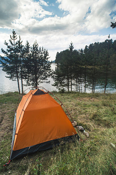 istock Tent in front of mountain dam 515828964