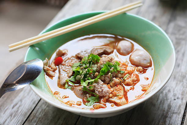 Spicy TOM YAM pork noodle soup stock photo