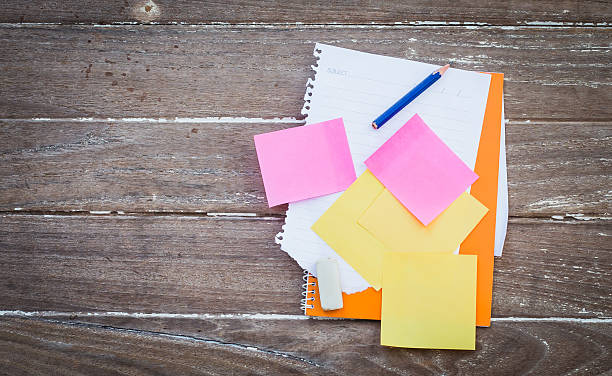istock stickers note,Note paper, pencil, eraser, notebook stickers on wood 515829650