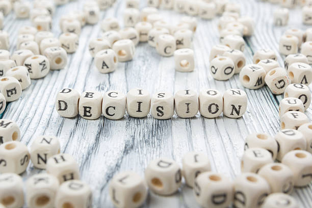 istock Decision word formed by wood alphabet blocks. Wooden ABC 515832350