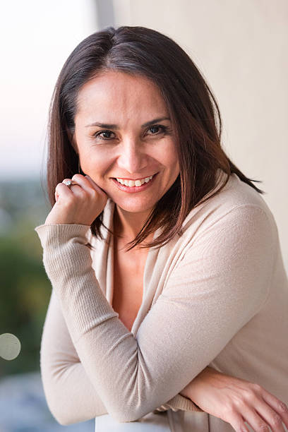istock Smiling mature hispanic woman 515832400