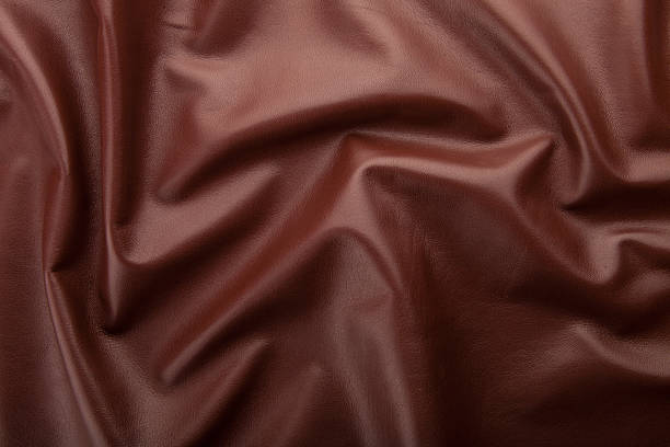istock dark brown leather background, grungy texture design 515832640