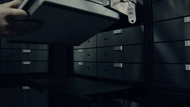 istock Putting metal container from safety deposit box 515835274