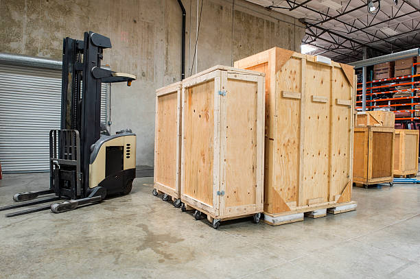 istock Forklift and wooden containers in manufacturing industry 515836157