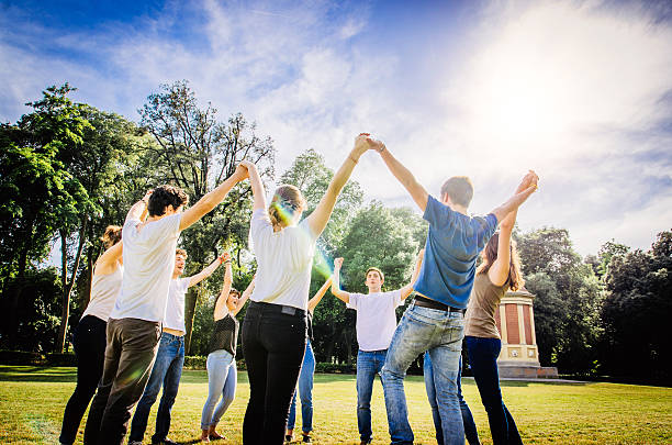 istock Friends holding hands in the park 515837199