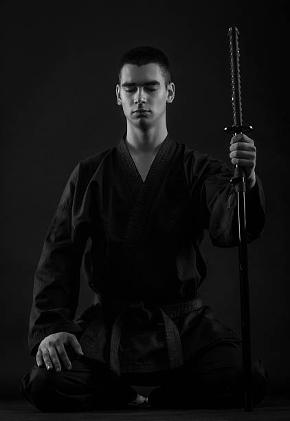 istock Young martial arts fighter with katana 515837858