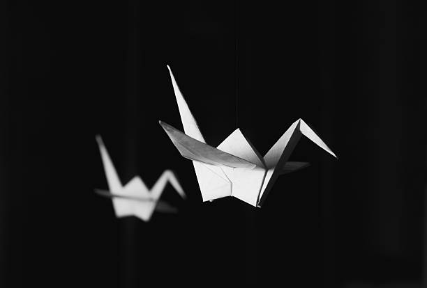 istock Origami crane and a dove soaring 515838218