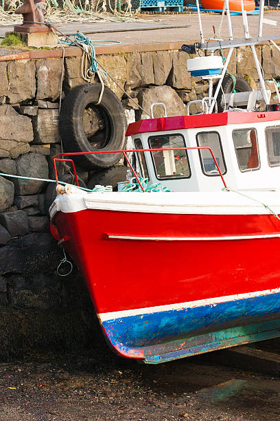 istock red fishing boat 515838792
