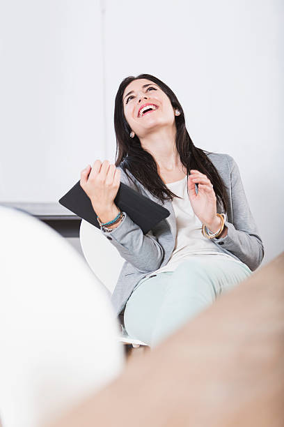 istock Young woman wih feet up, using digital tablet 515839183
