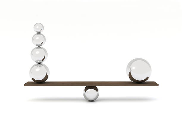 istock Balancing balls on wooden board 515839197