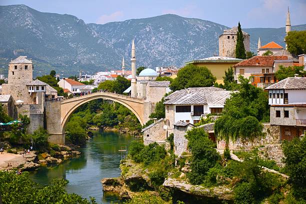 Picture perfect Mostar The new "old bridge" of Mostar Bosnia on a sunny day mostar stock pictures, royalty-free photos & images