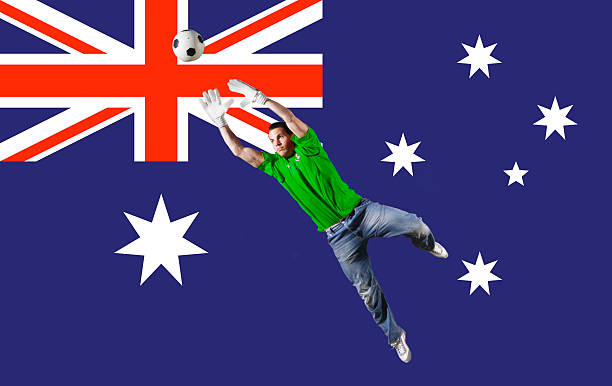 istock Goalkeeper saving ball in front of flag 515840739