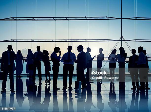 Multiethnic Group Of Business People In A Meeting Stock Photo - Download Image Now - Advice, Back Lit, Brainstorming